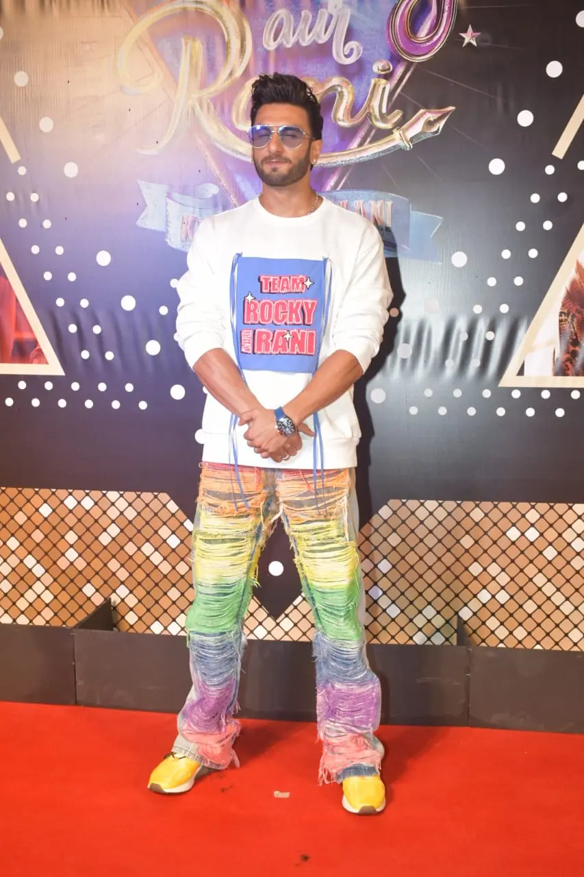 Bollywood's livewire, Ranveer Singh, added his signature charm and flair to the 'RARKPK' premiere, turning heads with his vibrant and colorful ensemble.